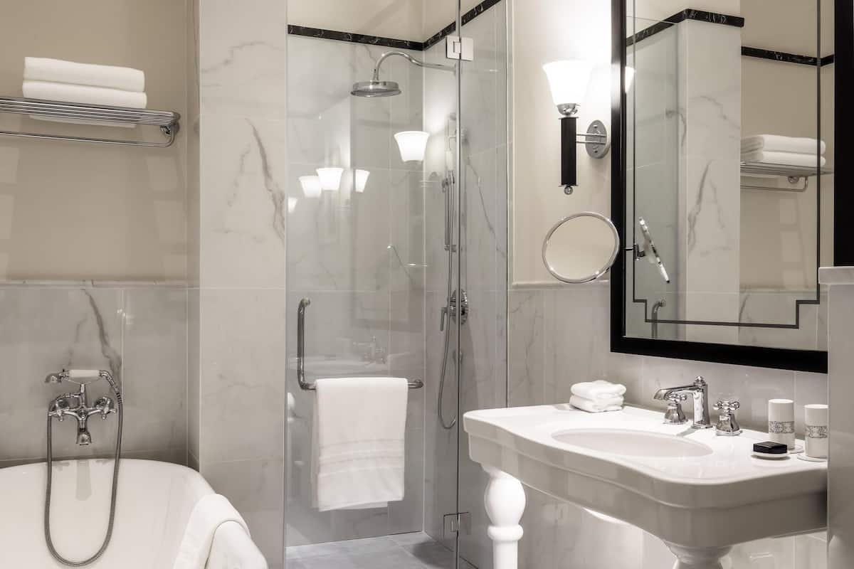 Separate tub and shower, rainfall showerhead, eco-friendly toiletries