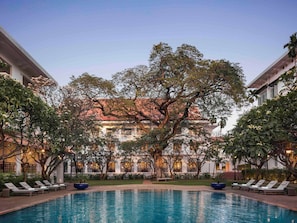 2 outdoor pools, open 6:00 AM to 8:00 PM, pool umbrellas