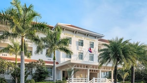 A white building with a sign reading "GRAND HOTEL D'ANGKOR."