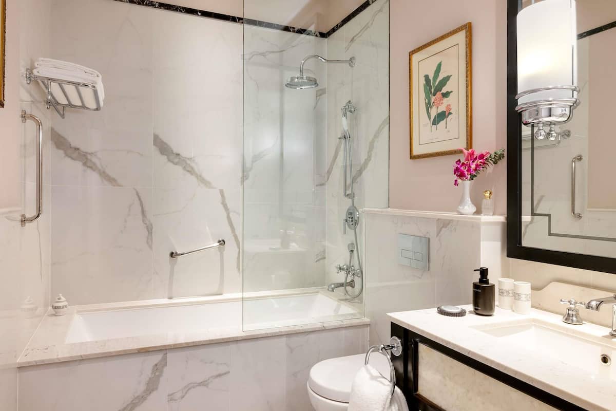 Separate bathtub and shower, rainfall showerhead, designer toiletries