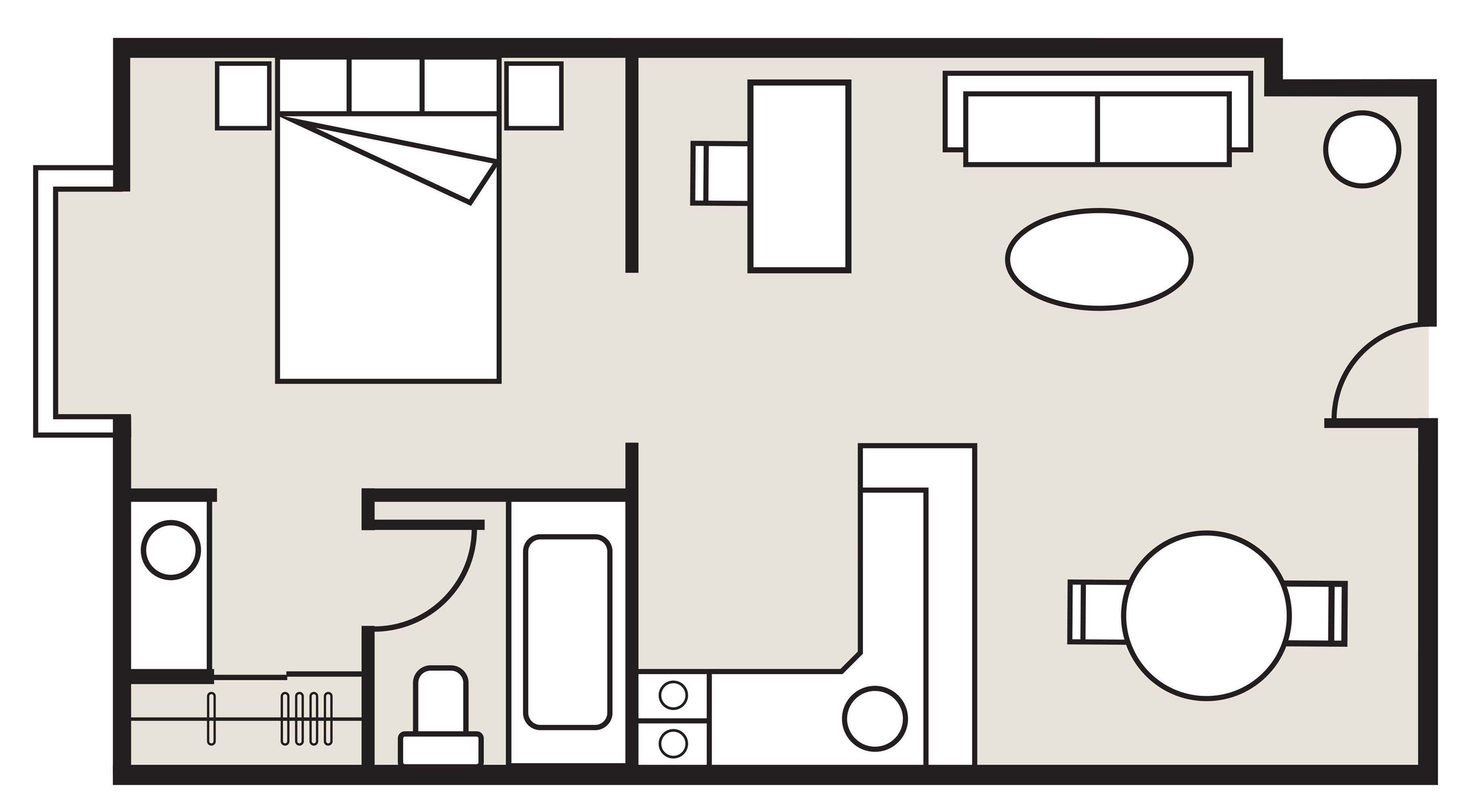A hotel room layout with a bed, desk, chair, and a small bathroom area.