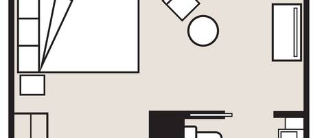 A hotel room layout with a bed, desk, chair, and a small bathroom area.