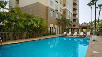 Outdoor pool, open 8:00 AM to 8:00 PM, pool loungers