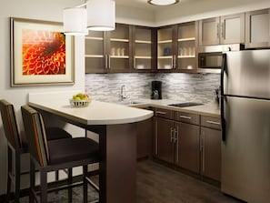 Full-sized fridge, microwave, stovetop, dishwasher