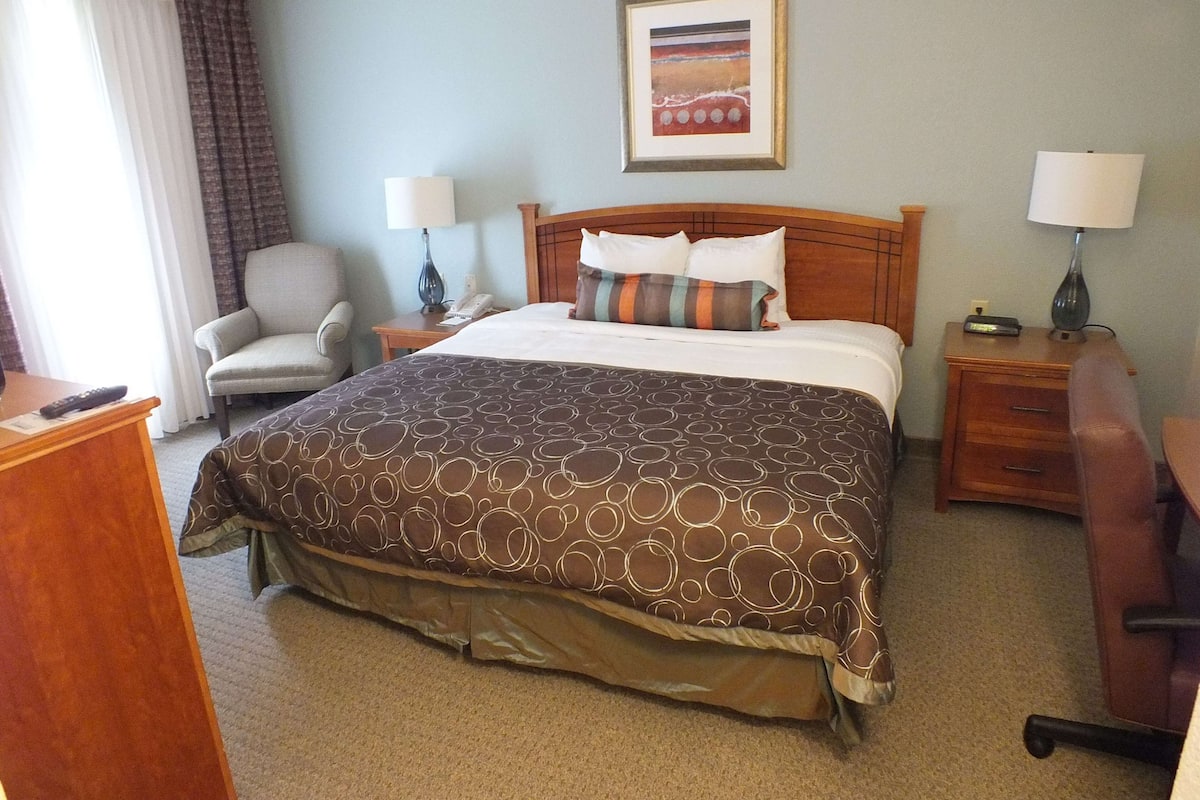 Desk, laptop workspace, blackout drapes, iron/ironing board