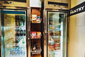 A refrigerated display case with snacks and beverages. - Staybridge Suites Irving Las Colinas by IHG (Irving)