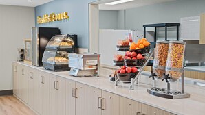 A breakfast buffet with various food options, including cereals, fruits, and pastries. - Days Inn by Wyndham Regina (Regina)