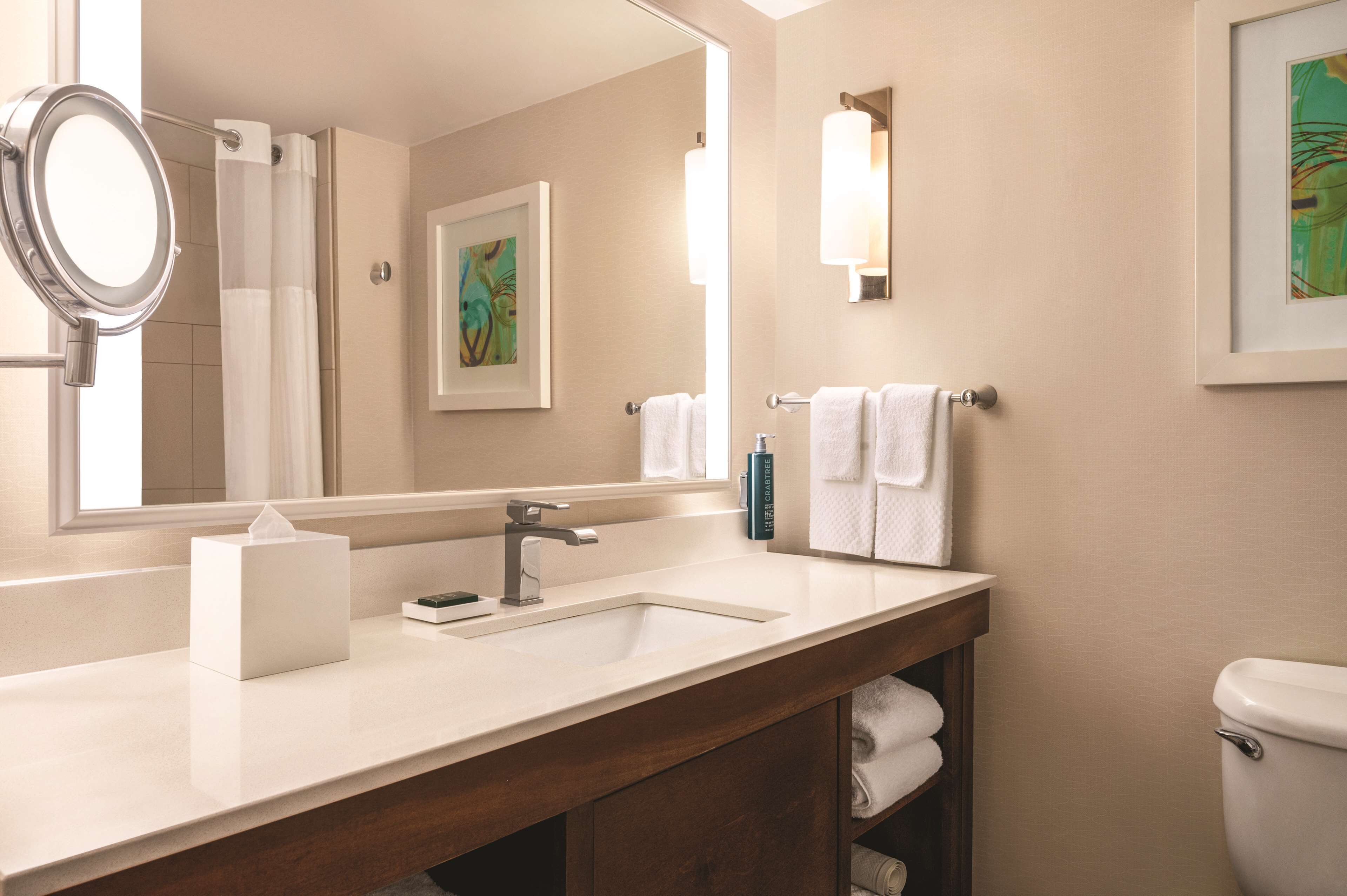 combined shower/bathtub, designer toiletries, hair dryer, towels