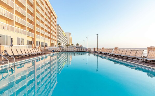 Outdoor pool, open 9:00 AM to 11:00 PM, pool umbrellas, sun loungers