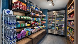 A grocery store with shelves stocked with snacks, beverages, and water. - Hampton Inn Hotel Detroit/Belleville-Airport Area (Belleville)
