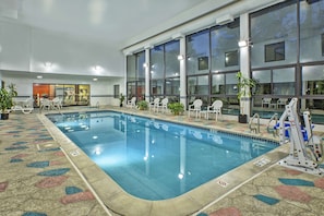 Indoor pool, open 9:00 AM to 10:00 PM, pool umbrellas, pool loungers