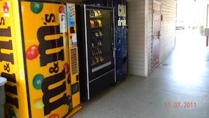 A row of vending machines in a covered area with a date stamp of 11.07.2011. - Stay Inn & Suites (Stockbridge)