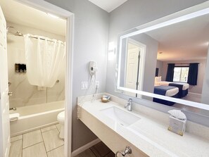 Standard Room, 2 Queen Beds, Non Smoking | Bathroom | Combined shower/tub, hair dryer, towels