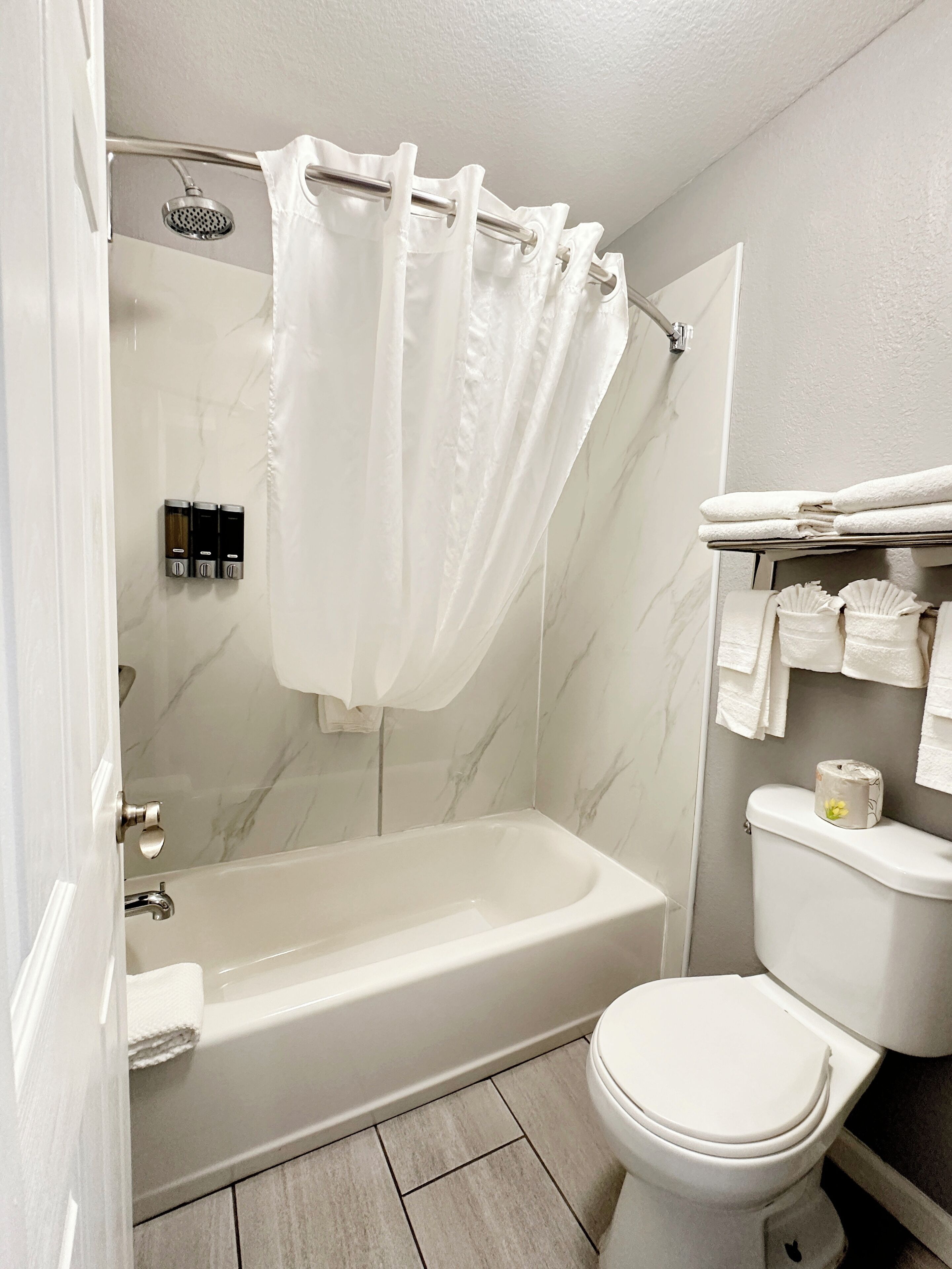 standard room, 2 queen beds, non smoking | bathroom | combined shower/bathtub, hair dryer, towels