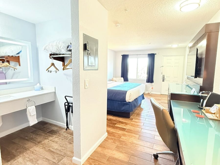 Desk, laptop workspace, blackout curtains, iron/ironing board