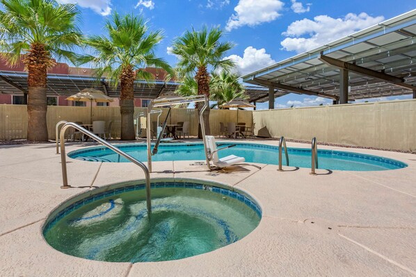 Outdoor pool, open 8:00 AM to 10 PM, pool loungers