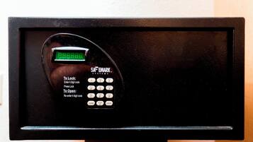 A digital safe with a keypad and a display screen.
