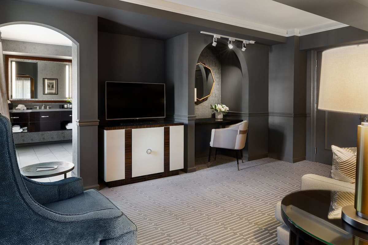 Suite, 1 King Bed | Living room | 42-inch flat-screen TV with cable channels, TV, iPod dock
