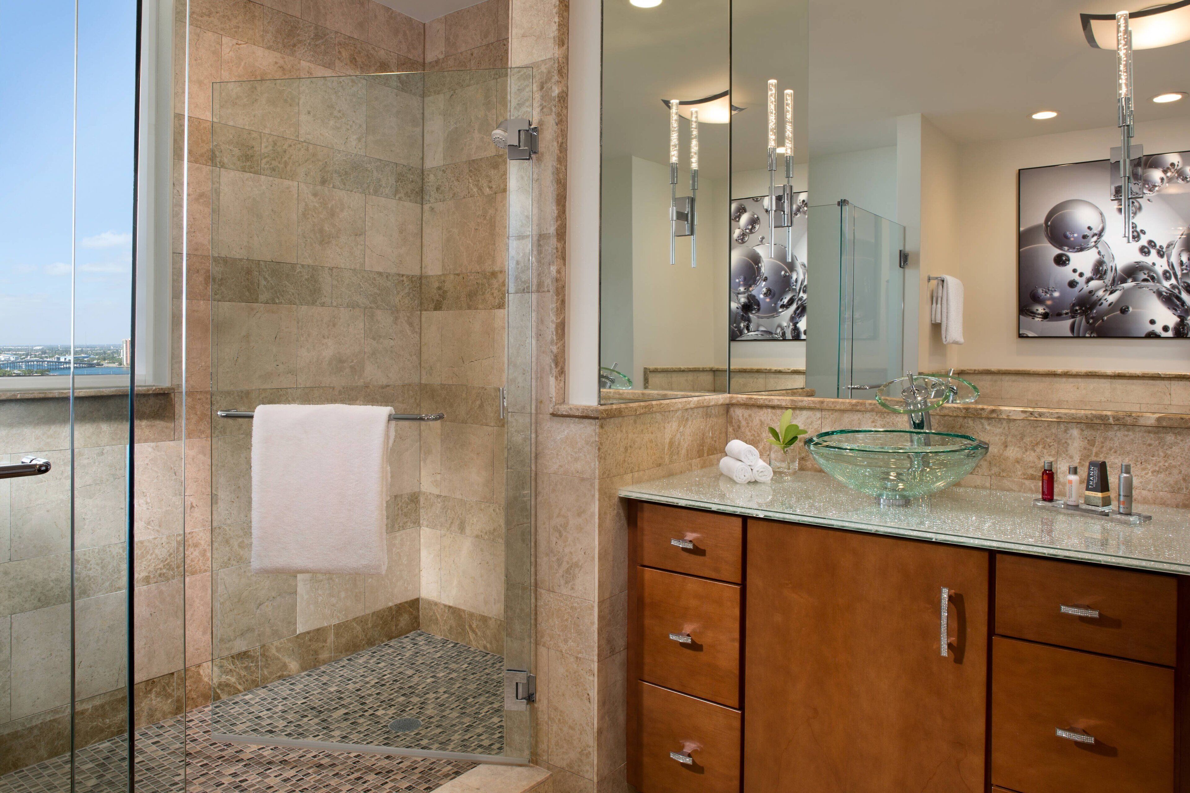 separate bathtub and shower, deep-soaking bathtub, designer toiletries