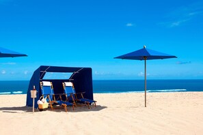 On the beach, beach cabanas, sun-loungers, beach umbrellas