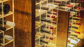 A wine rack with multiple bottles.