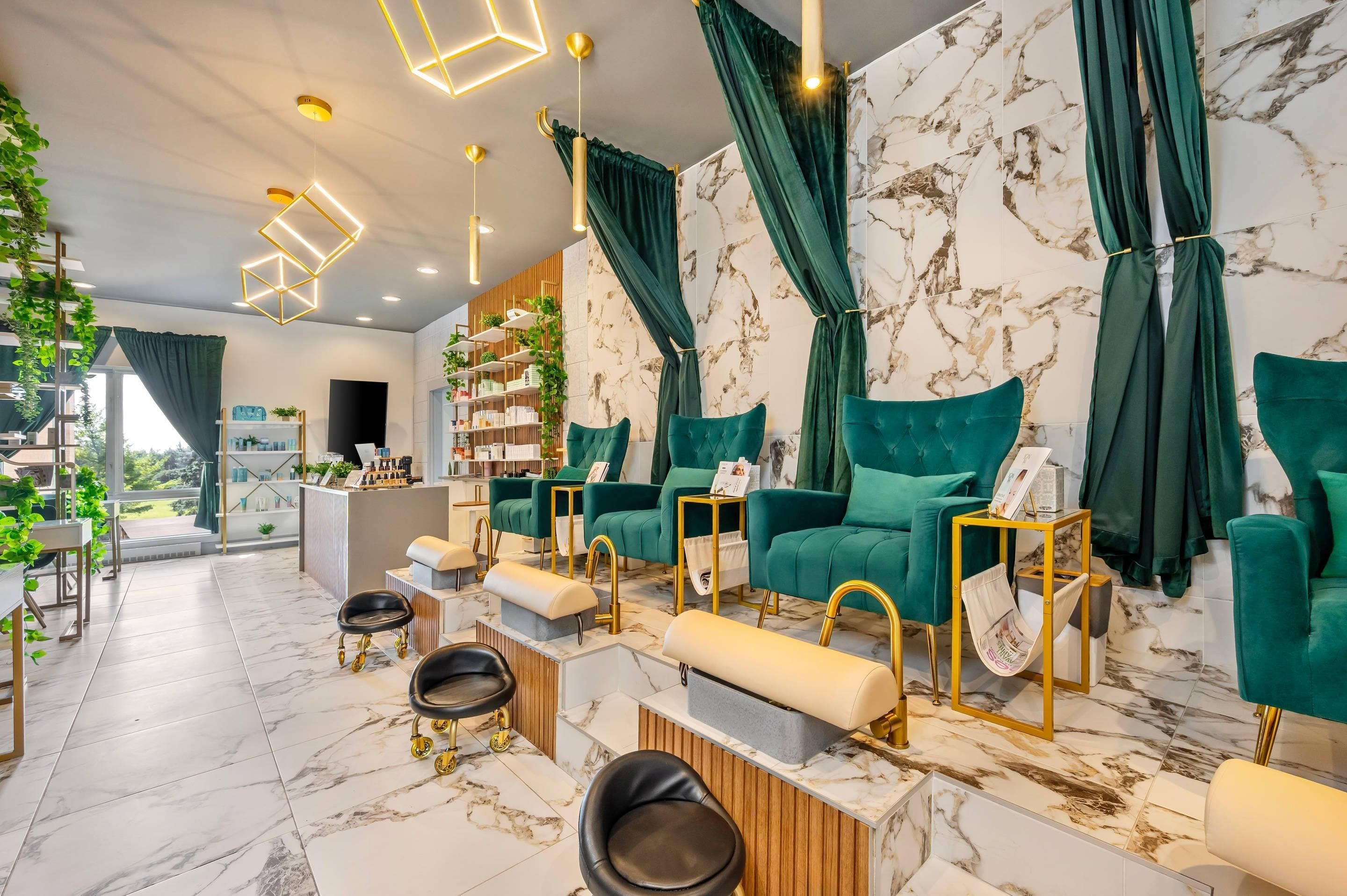 A modern interior with a seating area, marble flooring, and a reception desk.