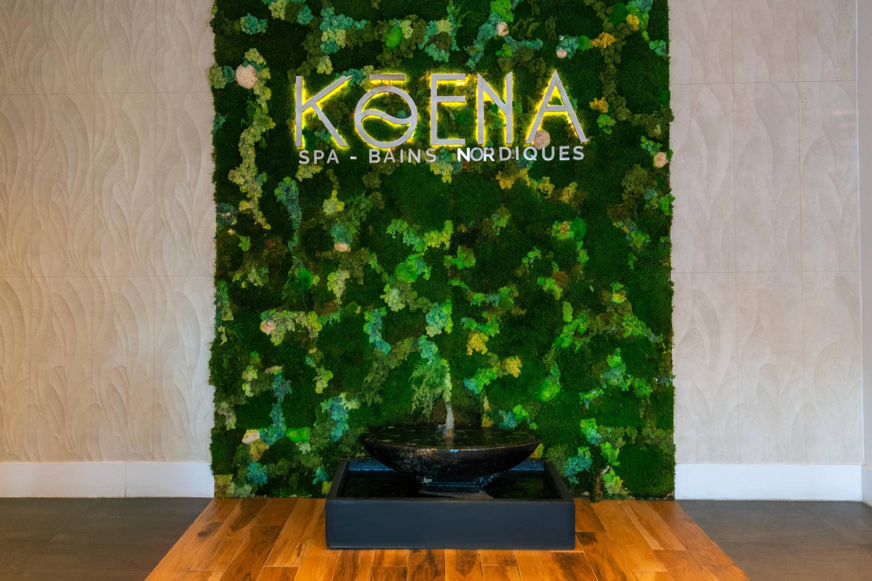 A spa area with a moss wall, a black basin, and the text 'KOENA SPA - BAINS NORDIQUES'.
