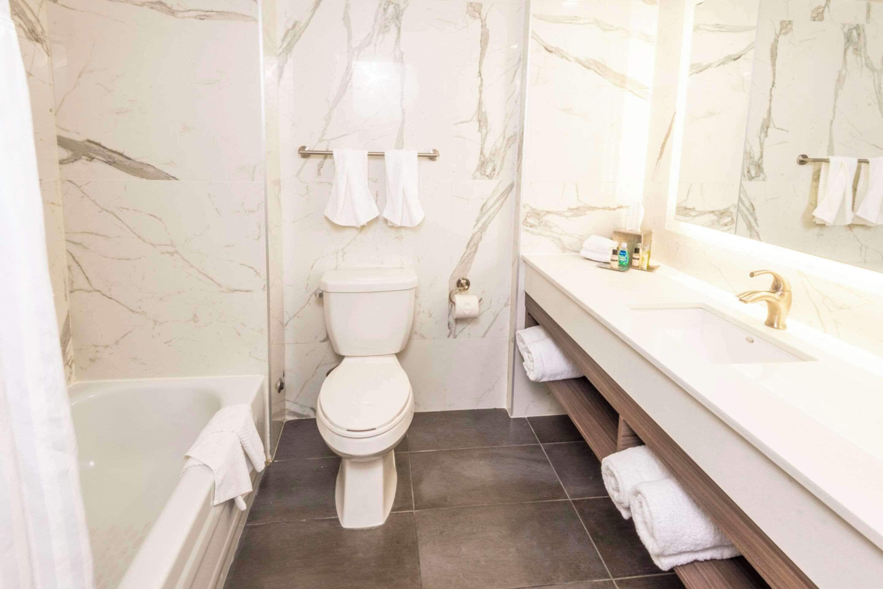 suite, 2 queen beds, non smoking (upgrade) | bathroom | combined shower/bathtub, deep-soaking bathtub, free toiletries, towels