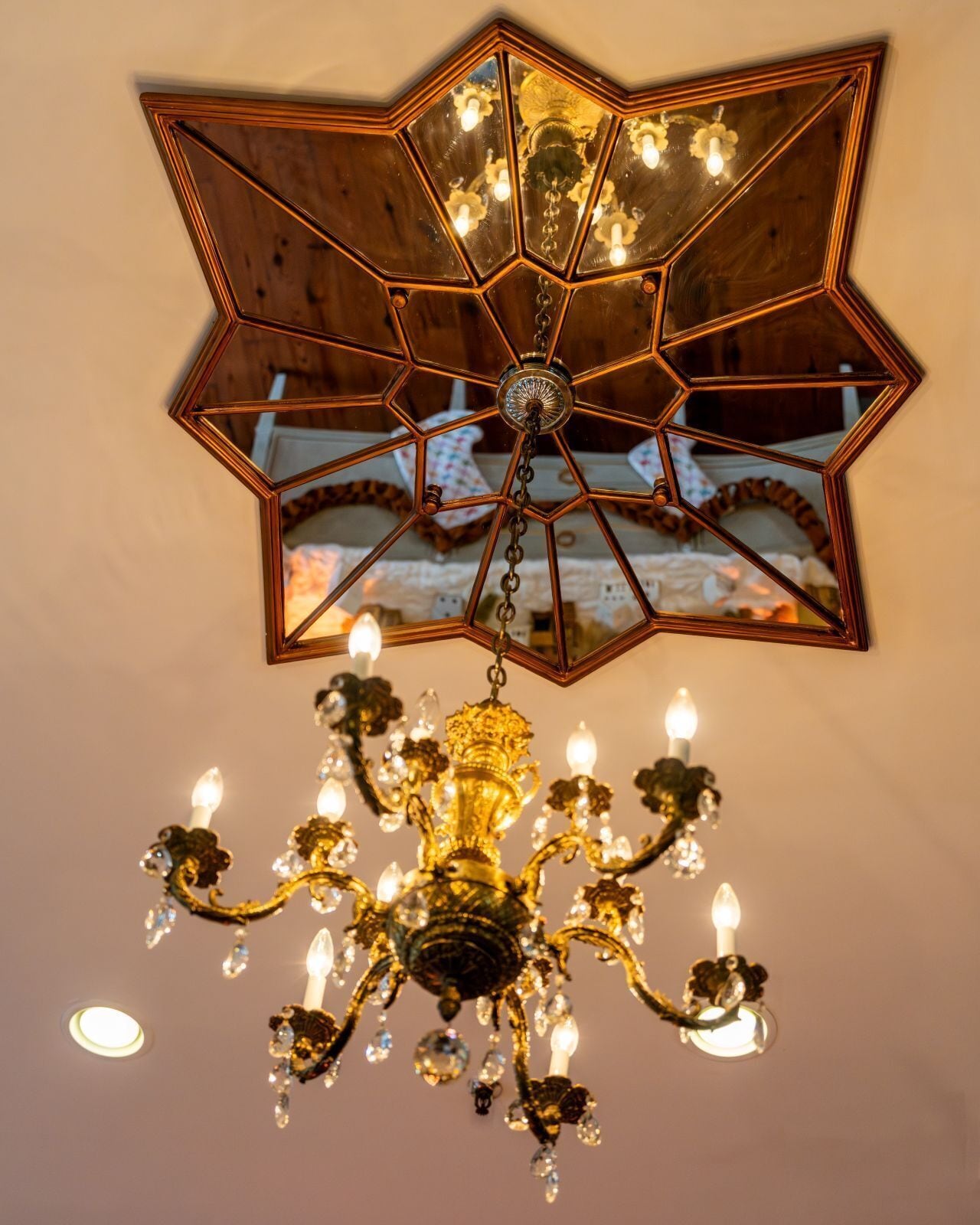 A chandelier with multiple arms and crystal decorations.