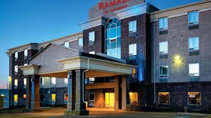 A multi-story hotel with a prominent sign reading "RAMADA BY WINDHAM". - Ramada by Wyndham Prince Albert (Prince Albert)