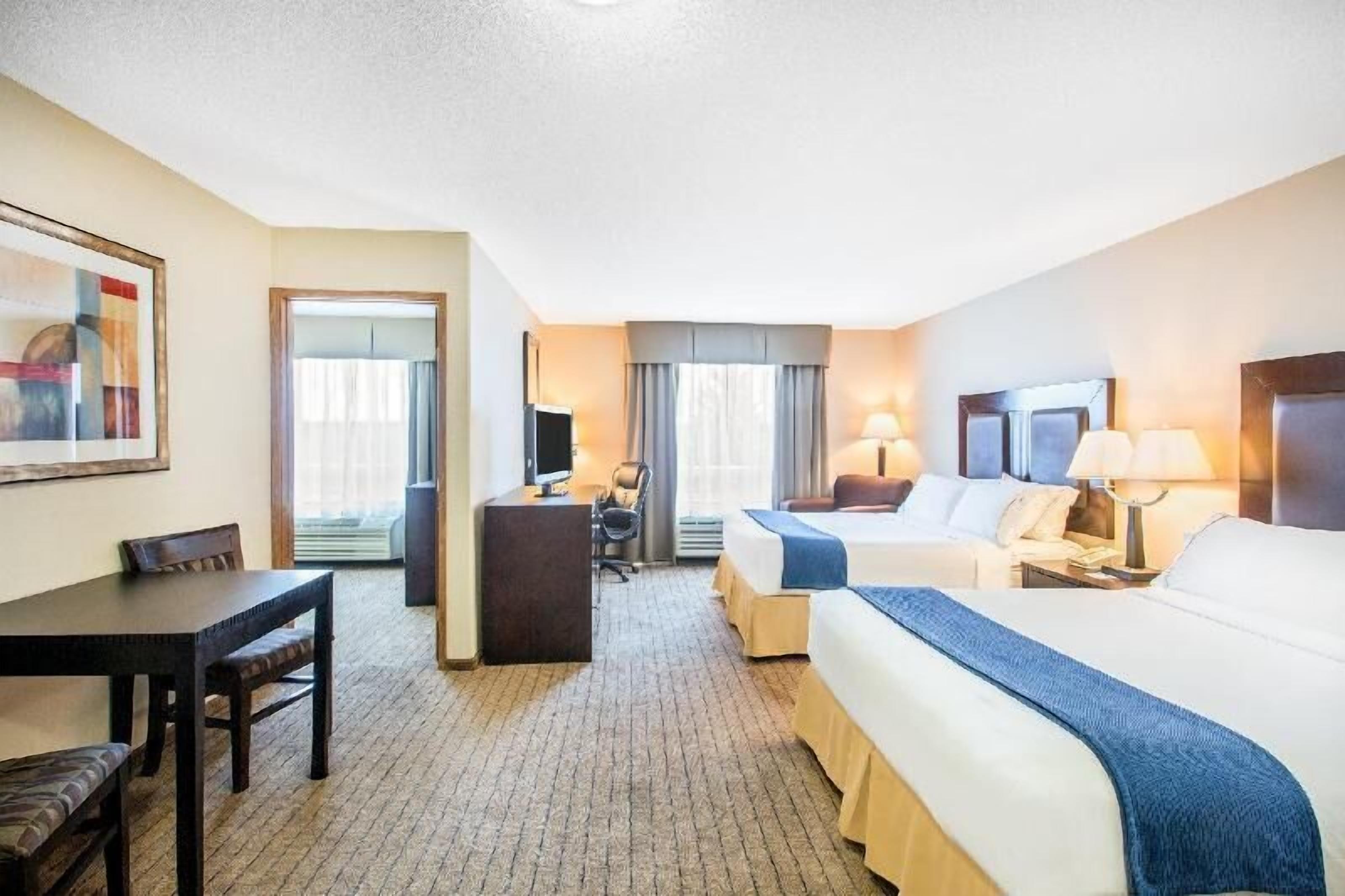 Pillow-top beds, desk, laptop workspace, soundproofing