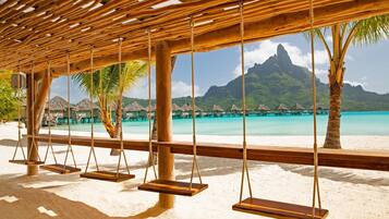 Private beach, white sand, sun loungers, beach umbrellas