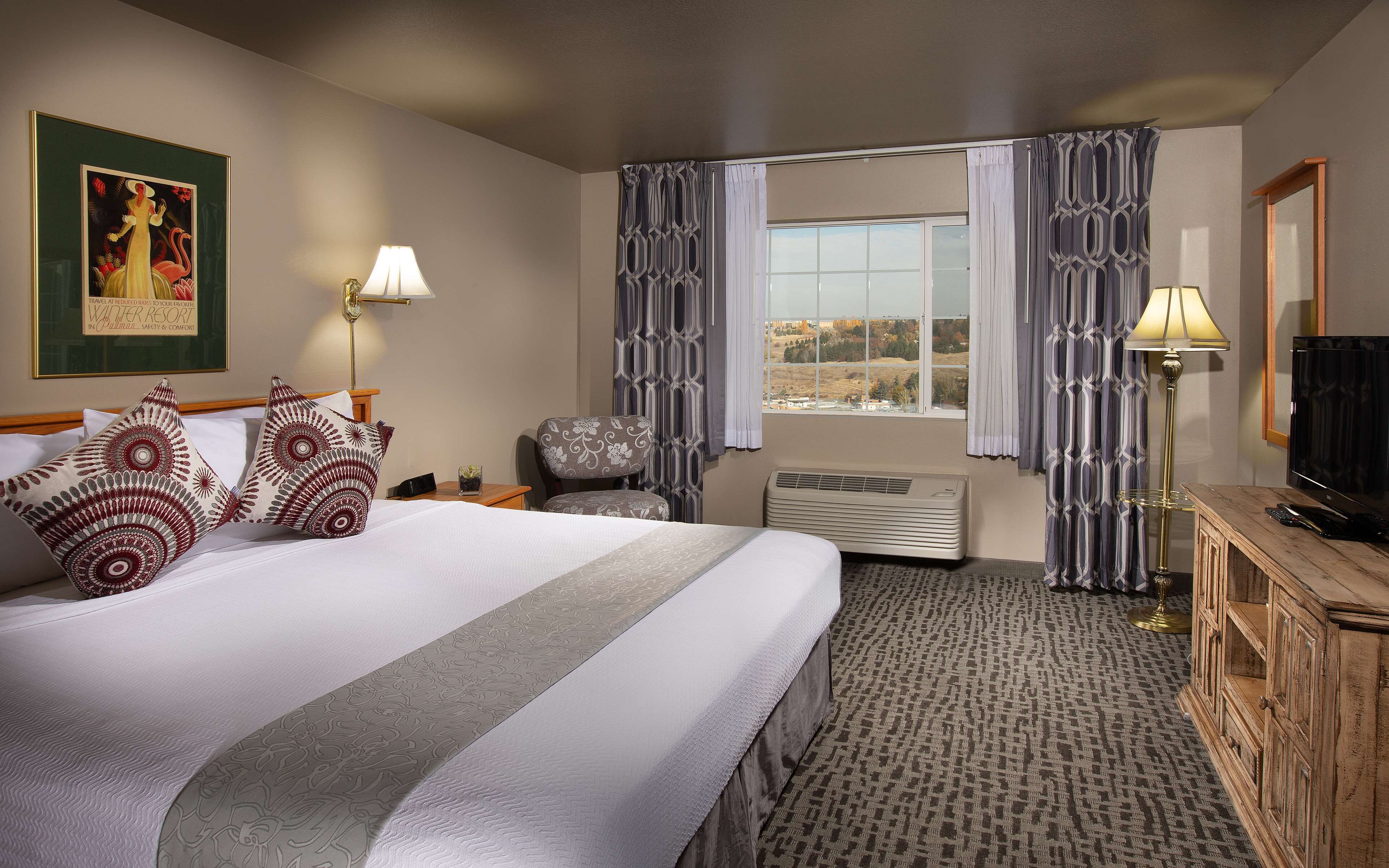 room, 1 king bed, city view (coast king with city view) | in-room safe, desk, blackout curtains, iron/ironing board