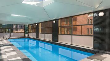 Indoor pool, open 6:00 AM to 10:00 PM, pool loungers