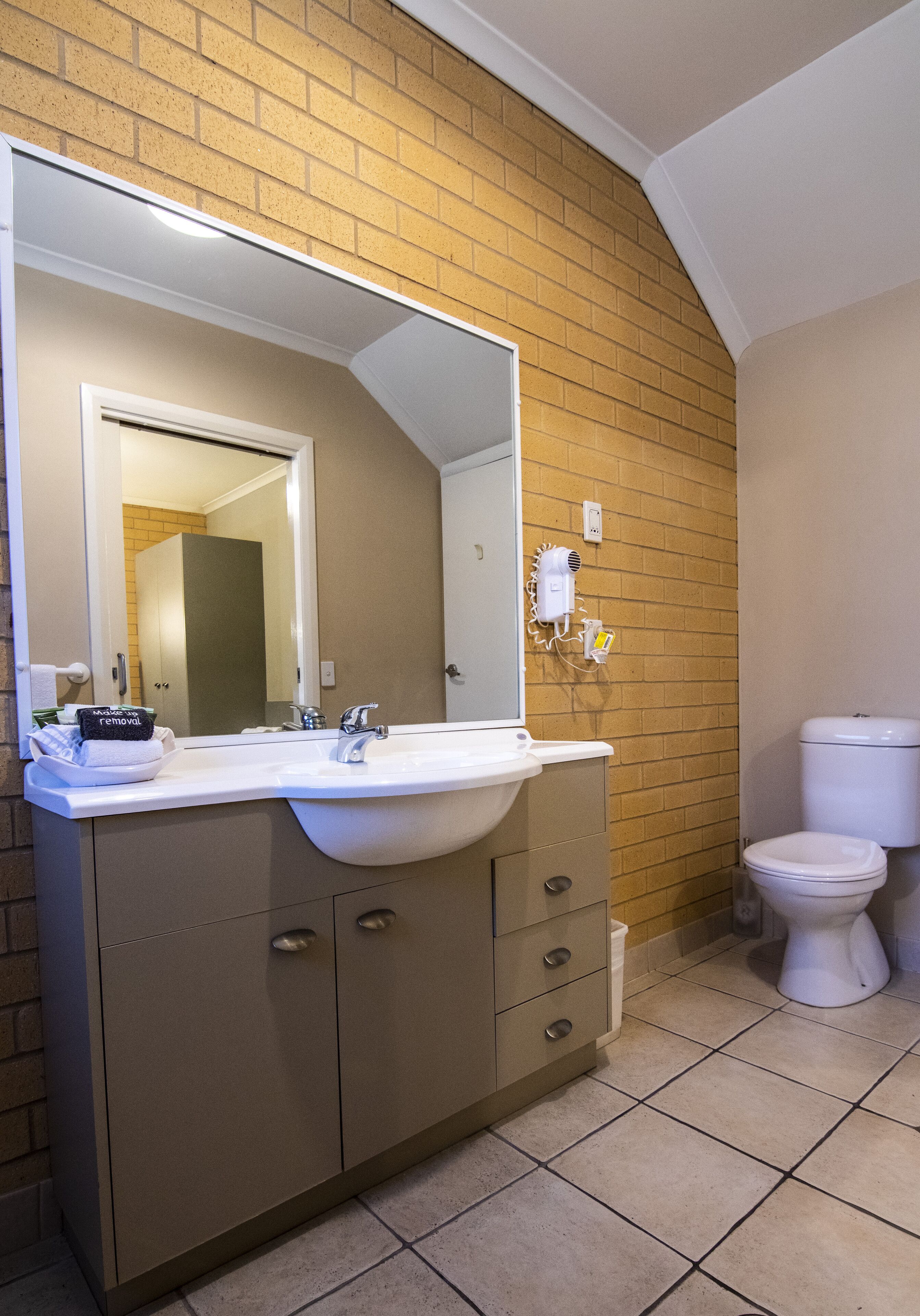 two bedroom apartment | bathroom | designer toiletries, hair dryer, towels