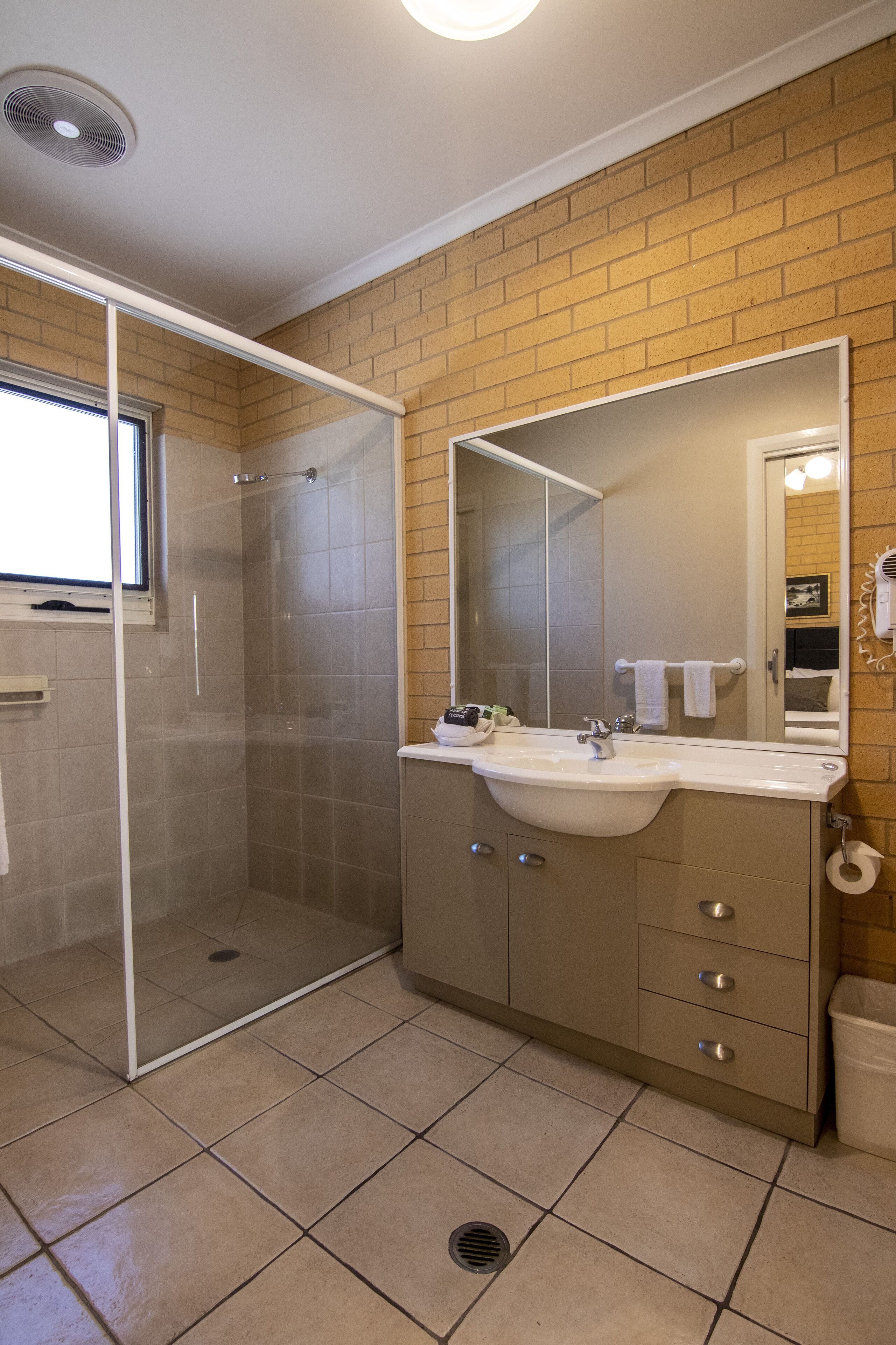 designer toiletries, hair dryer, towels