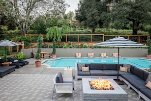 Outdoor pool, open 7:00 AM to 10:00 PM, pool umbrellas, pool loungers