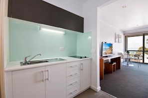 Fridge, microwave, stovetop, coffee/tea maker