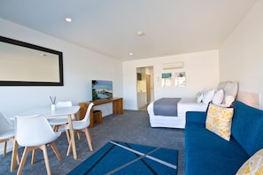 Deluxe Studio, Accessible | Living room
