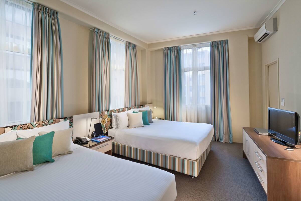 Family Room, 2 Queen Beds, Non Smoking, Kitchenette | In-room safe, blackout drapes, soundproofing, iron/ironing board