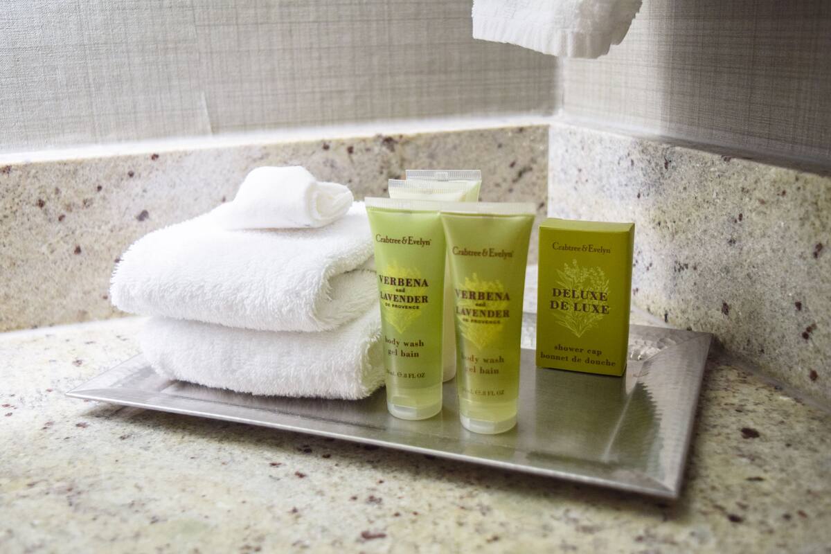 shower, designer toiletries, hair dryer, towels