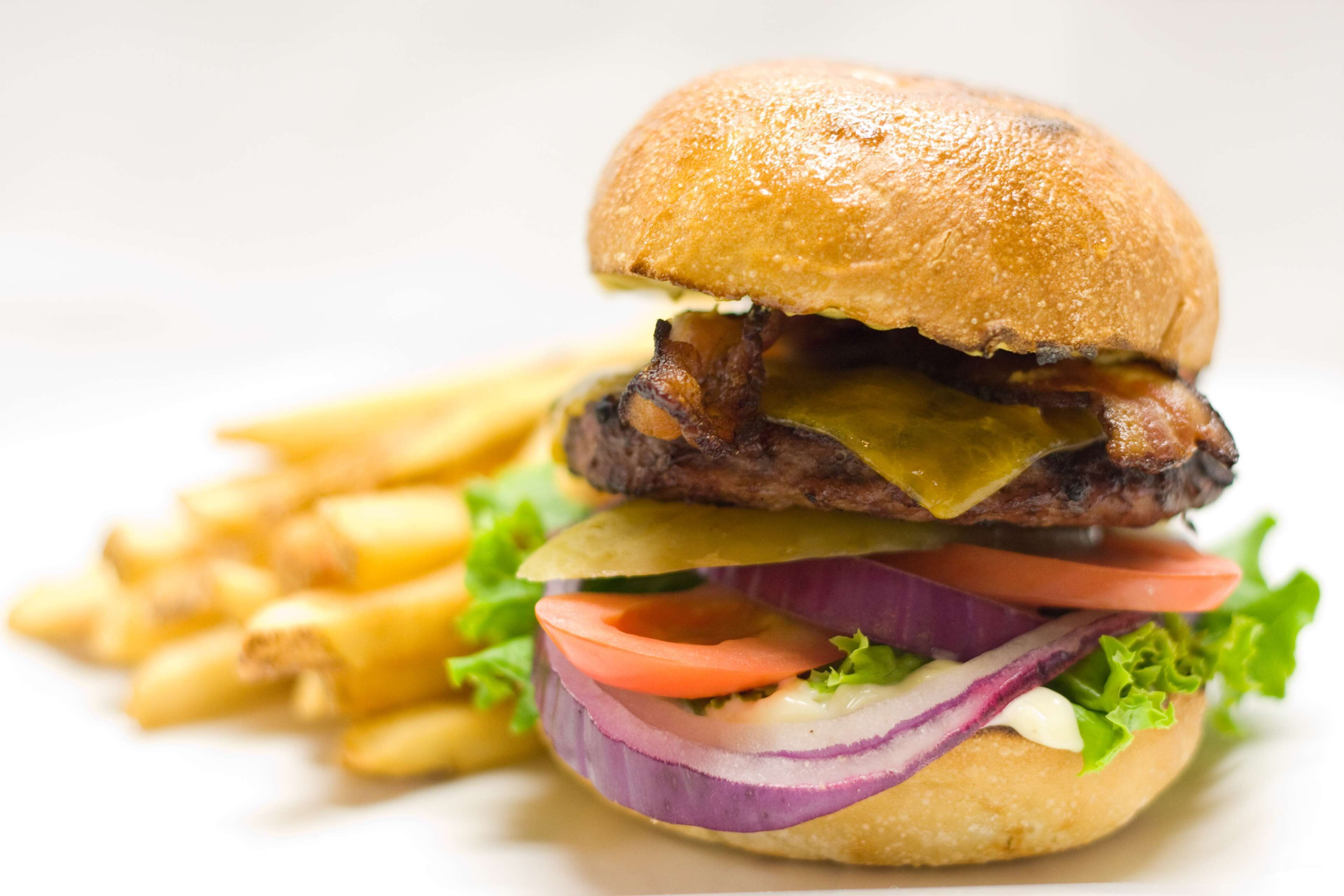 A burger with fries.