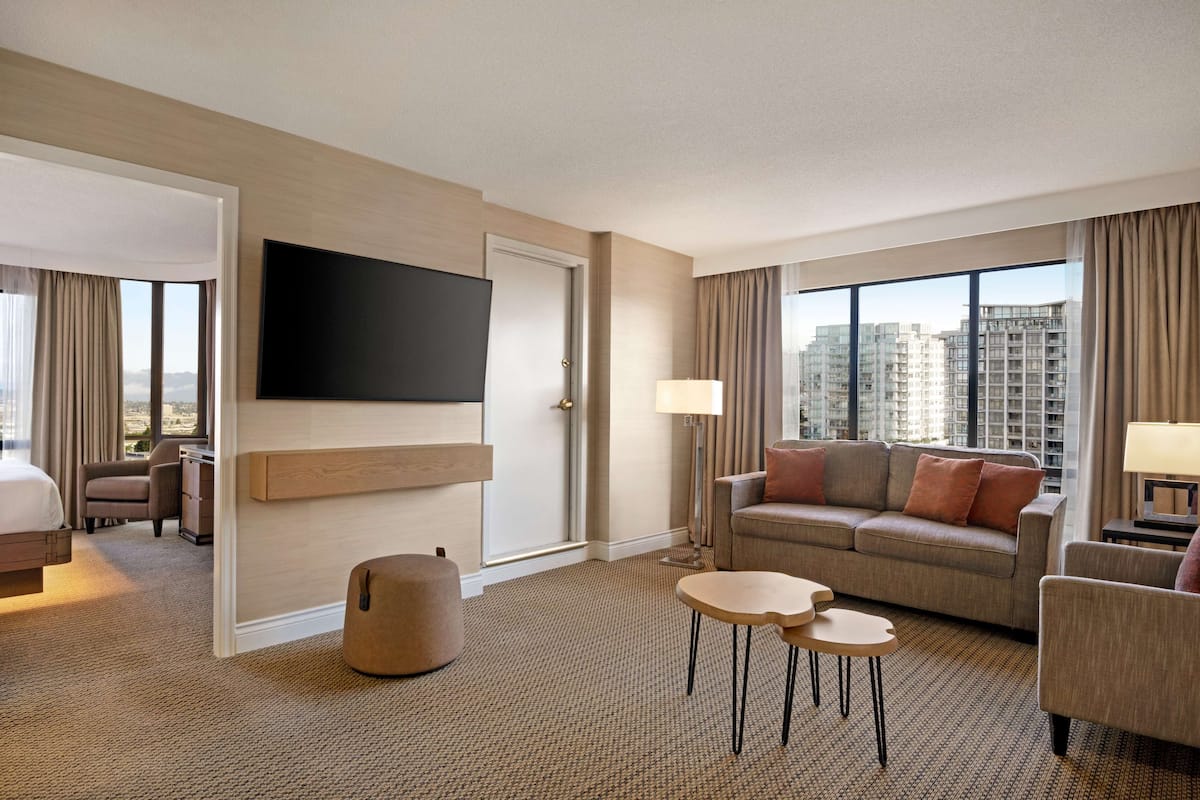 one king bed one bedroom suite | living area | 42-inch lcd tv with cable channels, tv, pay films