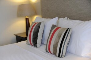 Minibar, système d’insonorisation, fer et planche à repasser
