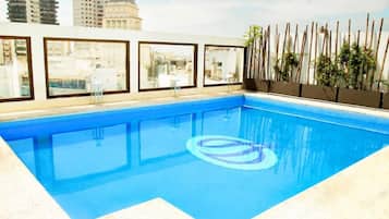 Seasonal outdoor pool, pool umbrellas, pool loungers