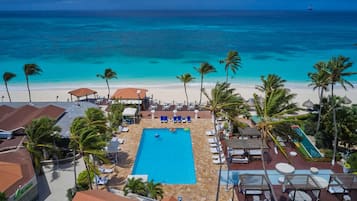 On the beach, white sand, sun loungers, beach towels