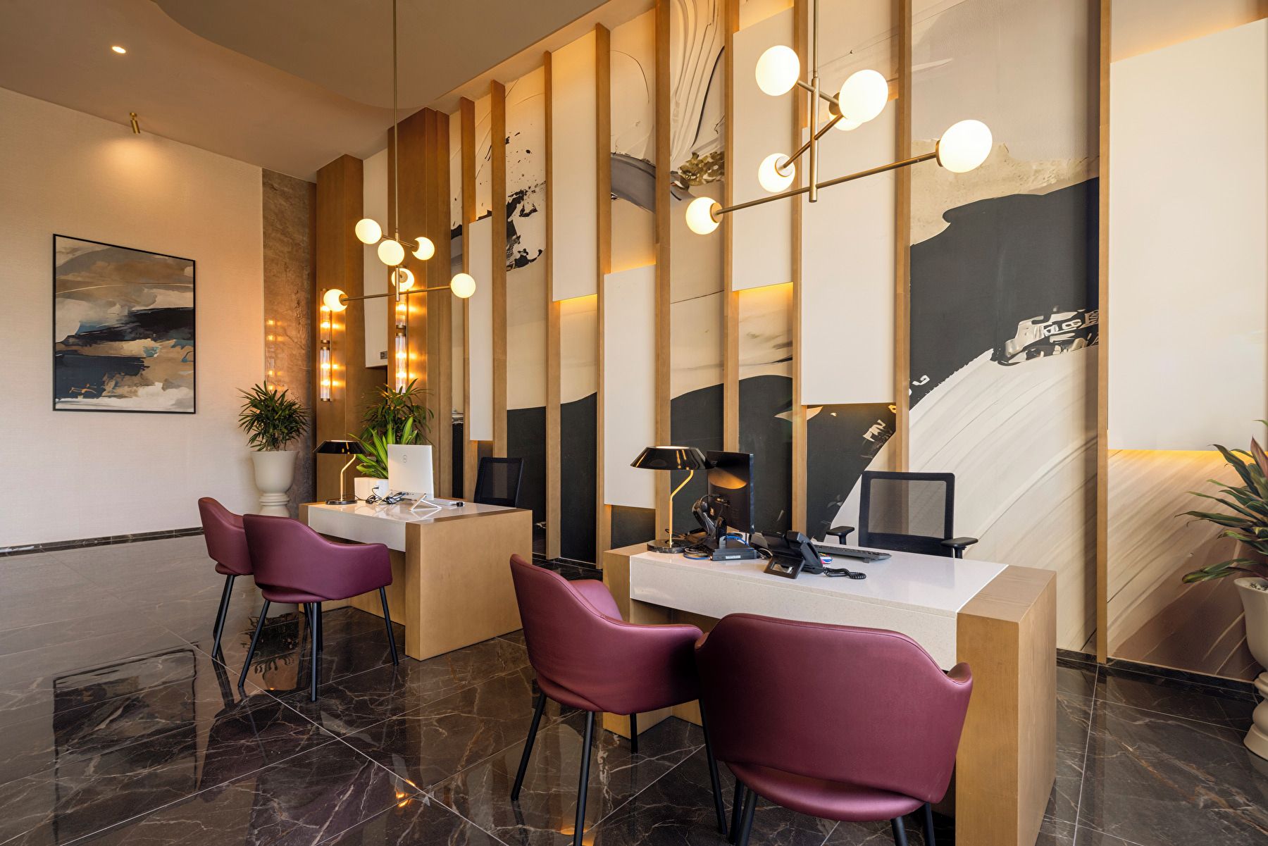 A modern office space with a desk, chairs, and a unique wall art piece.