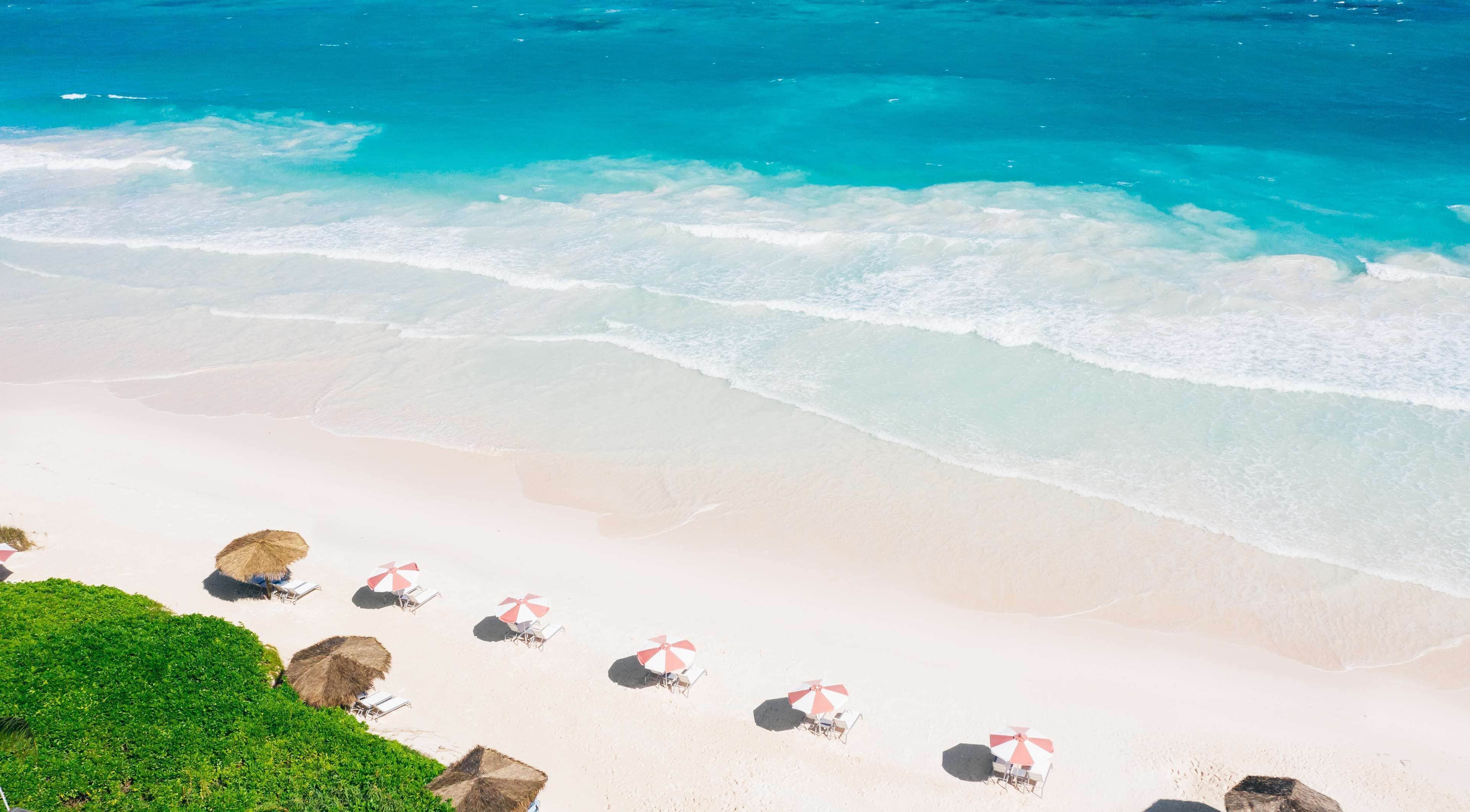 On the beach, white sand, free beach cabanas, sun loungers