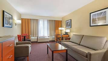 Suite, 1 King Bed, Non Smoking, Refrigerator & Microwave (with Single Sofabed) | Pillowtop beds, blackout drapes, iron/ironing board, Internet