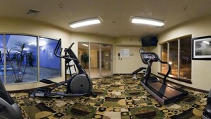 A gym with two treadmills, a stationary bike, and a patterned floor. - Holiday Inn Express Hotel & Suites Pleasant Prairie-Kenosha by IHG (Pleasant Prairie)